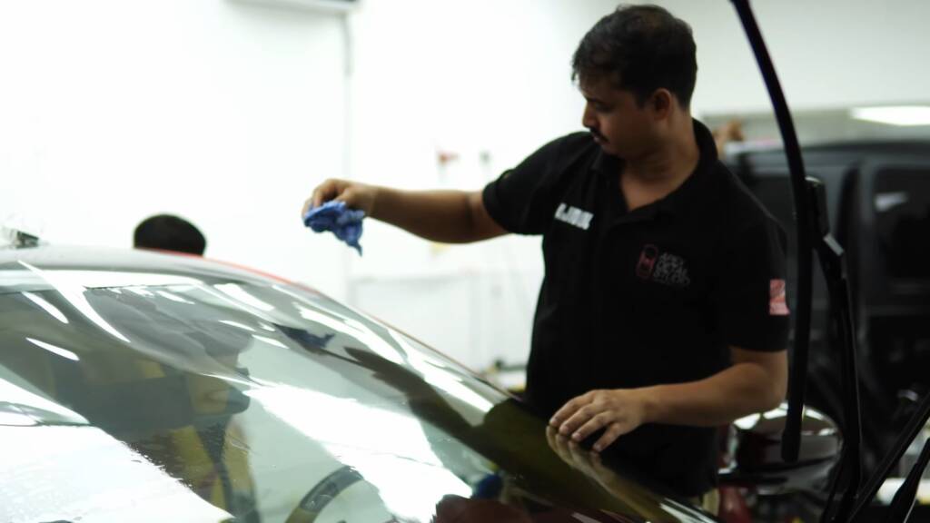 Final wipe down of a Mansory Pugnator after PPF