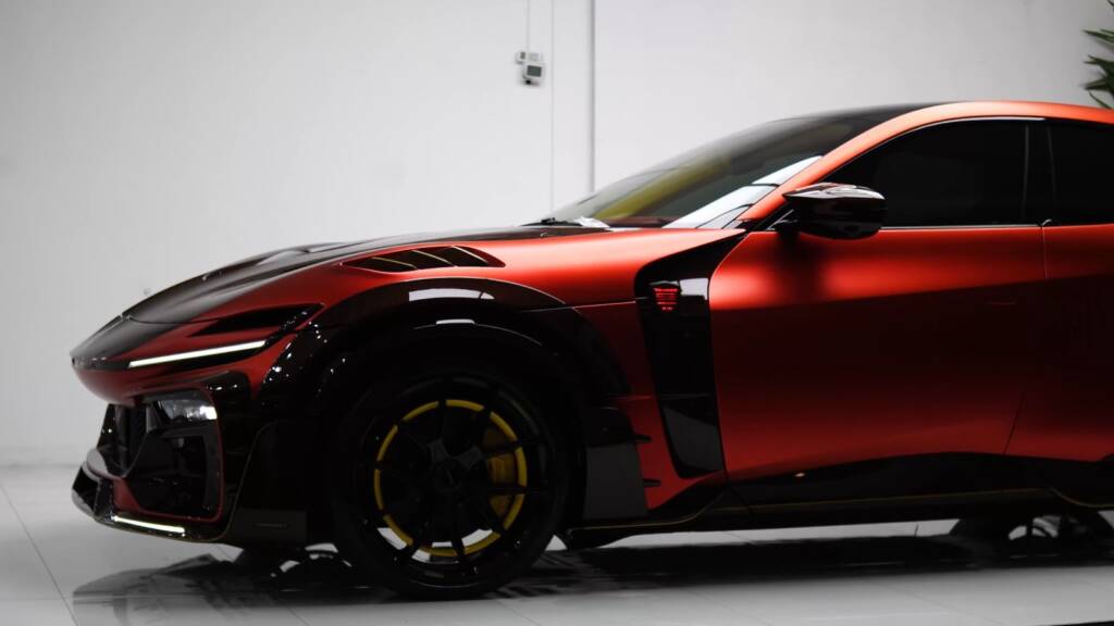 Side profile of a red Mansory Pugnator before PPF in Dubai