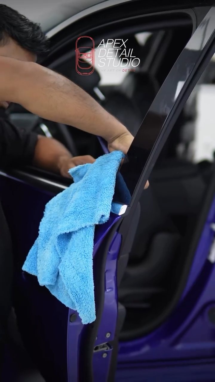 Microfibre wipe on the blue Maserati Grecale door shut at Apex Detail Studio Dubai