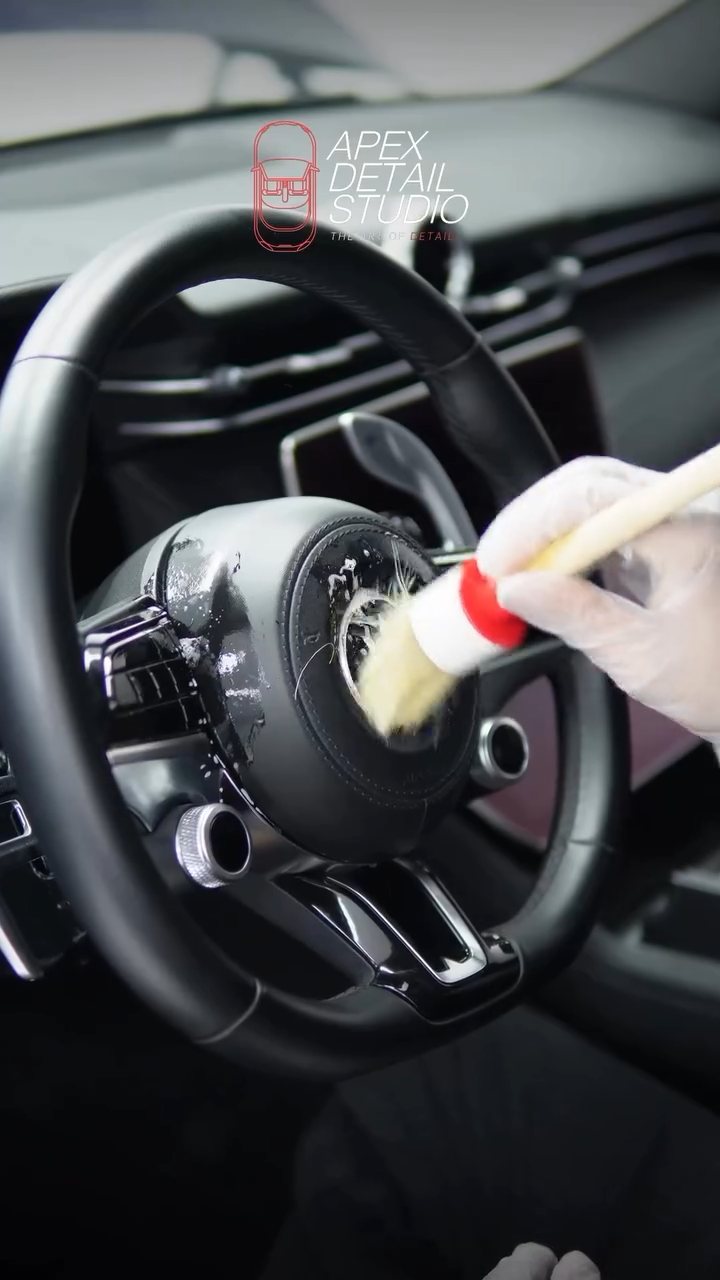 Detailing brush cleaning the Maserati Grecale steering wheel at Apex Detail Studio Dubai