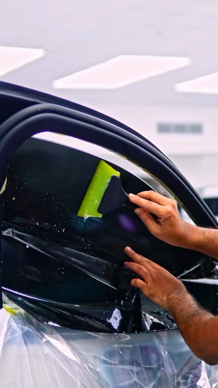Tint film being placed on the Maybach S580 rear door glass