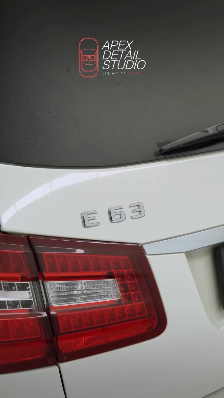 Mercedes-AMG E63 badge and tail light during the wash in Dubai