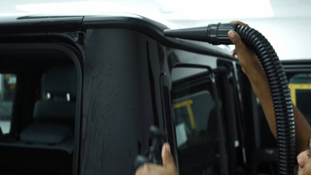 Drying a black Mercedes-AMG G63 before film installation