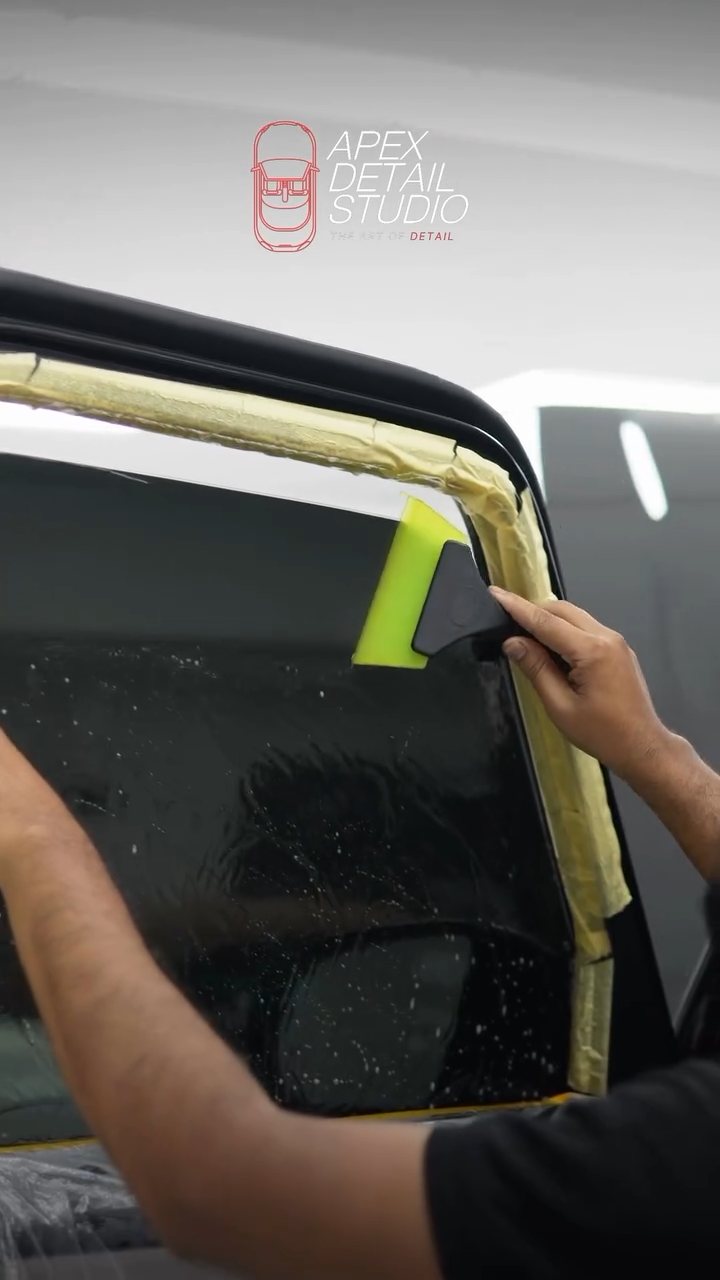 Finishing the window tint corner on the Mercedes-AMG G63