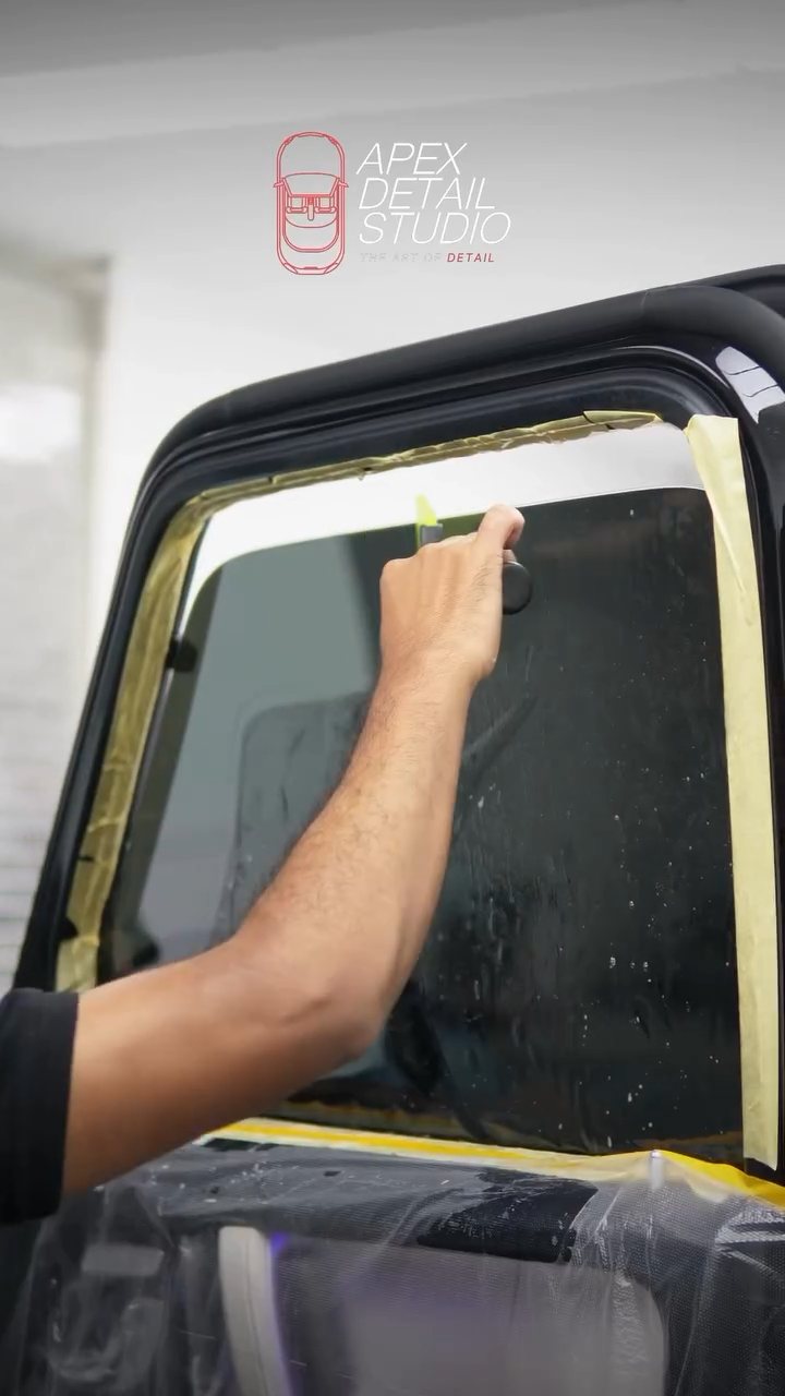 Final squeegee on the Mercedes-AMG G63 window tint in Dubai