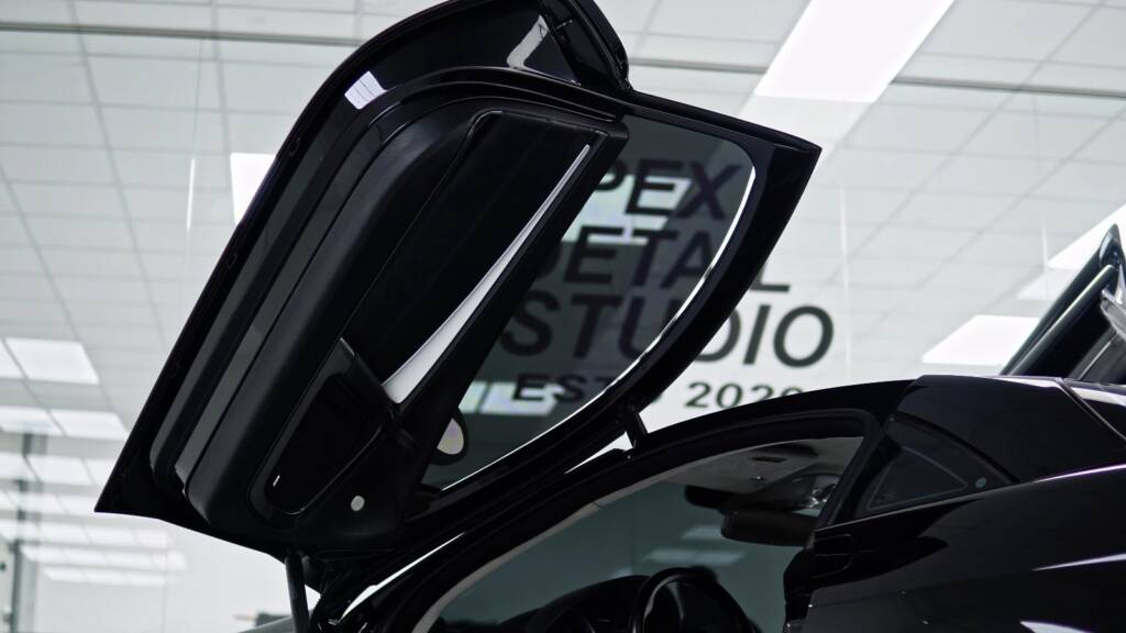 Butterfly door of a black Mercedes-Benz SLR McLaren open at Apex Detail Studio Al Quoz Dubai