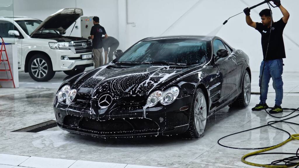 Black Mercedes-Benz SLR McLaren covered in foam during a pre-PPF wash at Apex Detail Studio Dubai