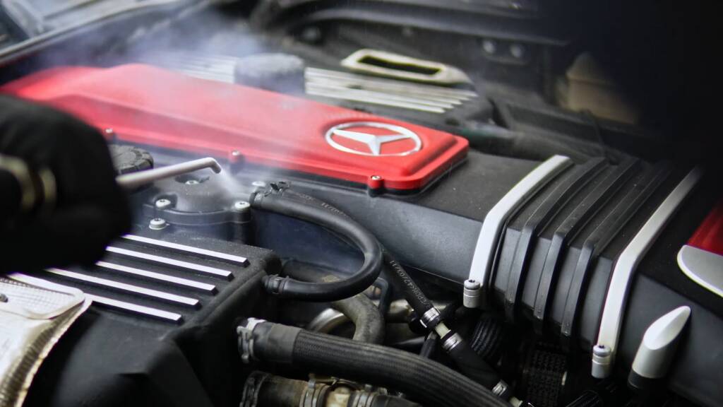 Dry ice blasting around the red engine cover of a Mercedes-Benz SLR McLaren supercharged V8 in Dubai