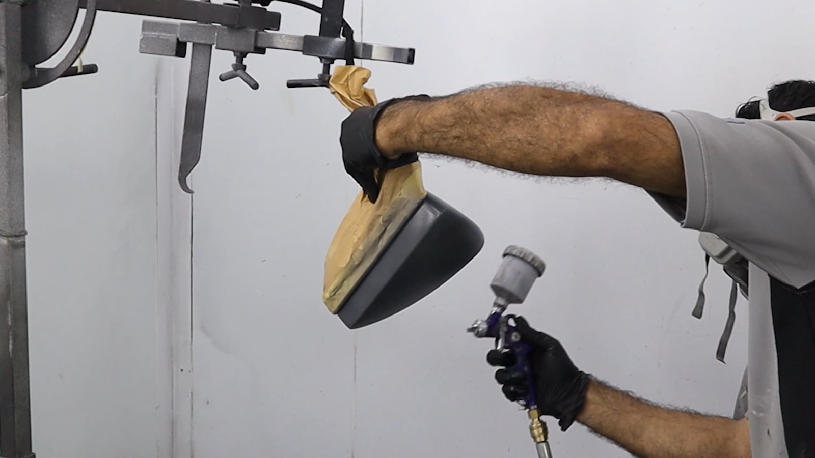 Mirror cap being sprayed at Apex Detail Studio