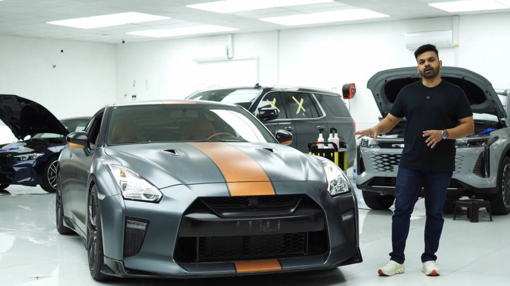 Nissan GTR in faded grey wrap with copper stripe before removal in Dubai