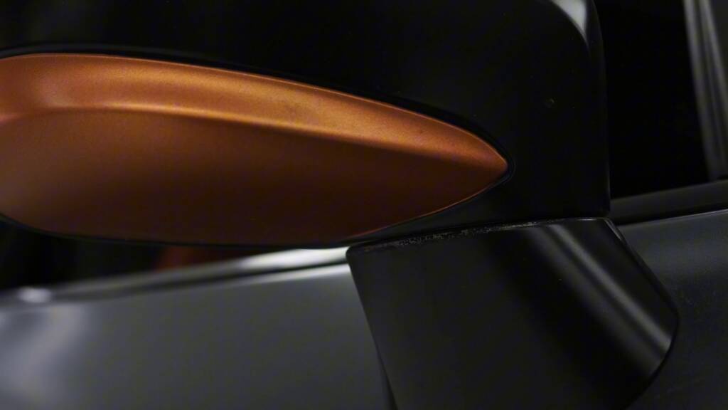 Faded copper wrap on a Nissan GTR mirror