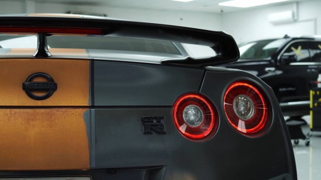 Nissan GTR rear with old copper stripe wrap