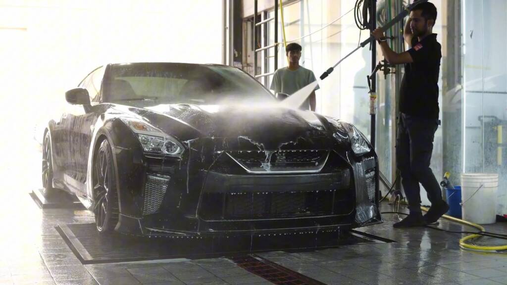 Nissan GTR in the wash bay after wrap removal