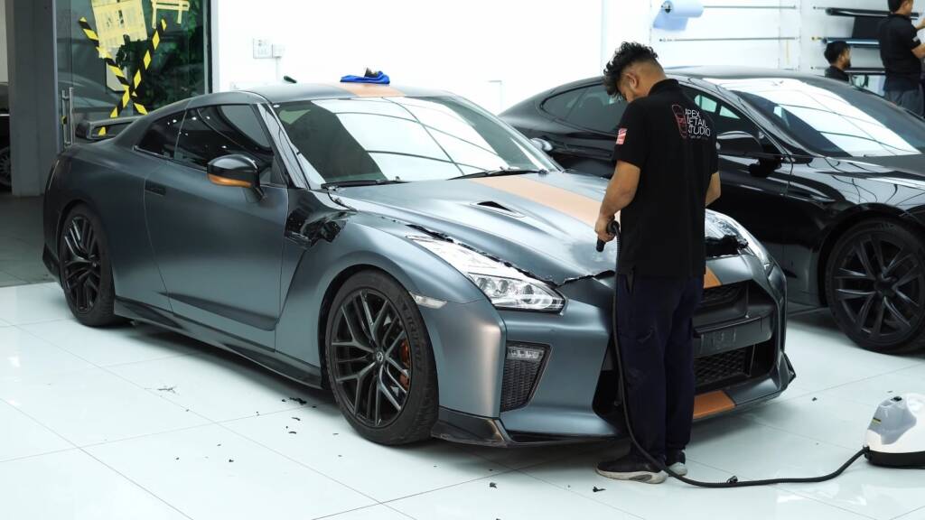Removing the old wrap from a Nissan GTR
