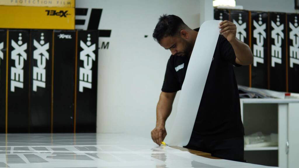Installer with a premium film roll for a Nissan Patrol Nismo