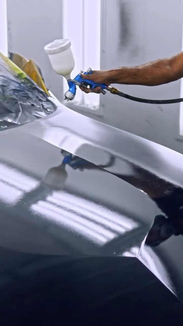 Spray gun over the Nissan Z bonnet during the peelable paint job at Apex Detail Studio Dubai