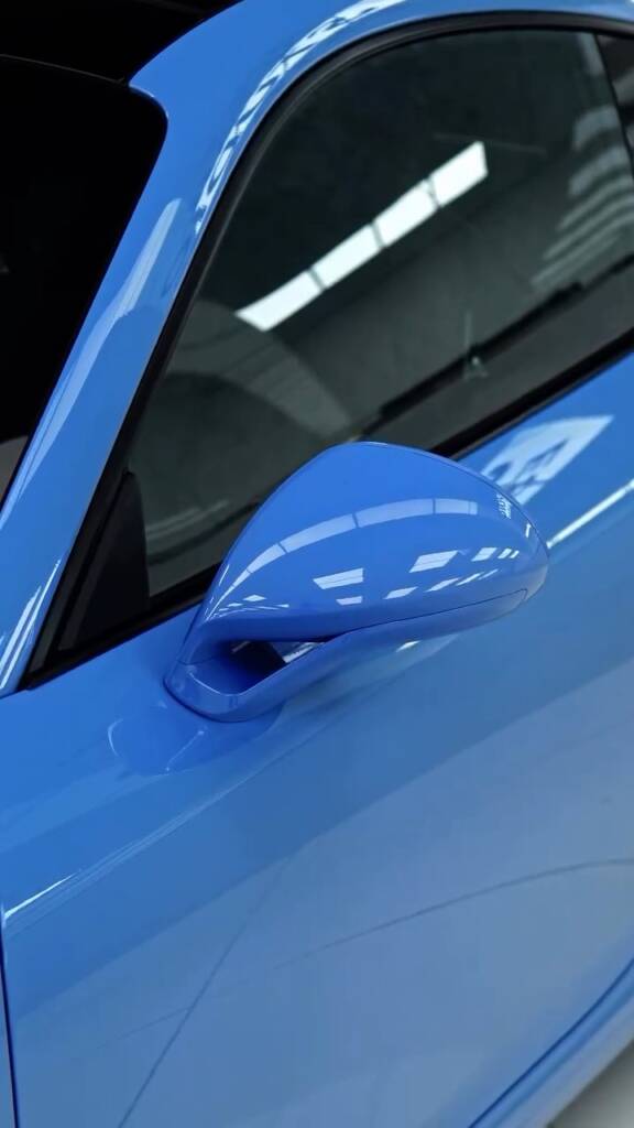 Porsche 911 Carrera door mirror after blue colour change PPF in Dubai
