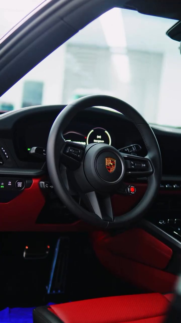 Porsche 911 Carrera cabin with red leather at Apex Detail Studio Dubai