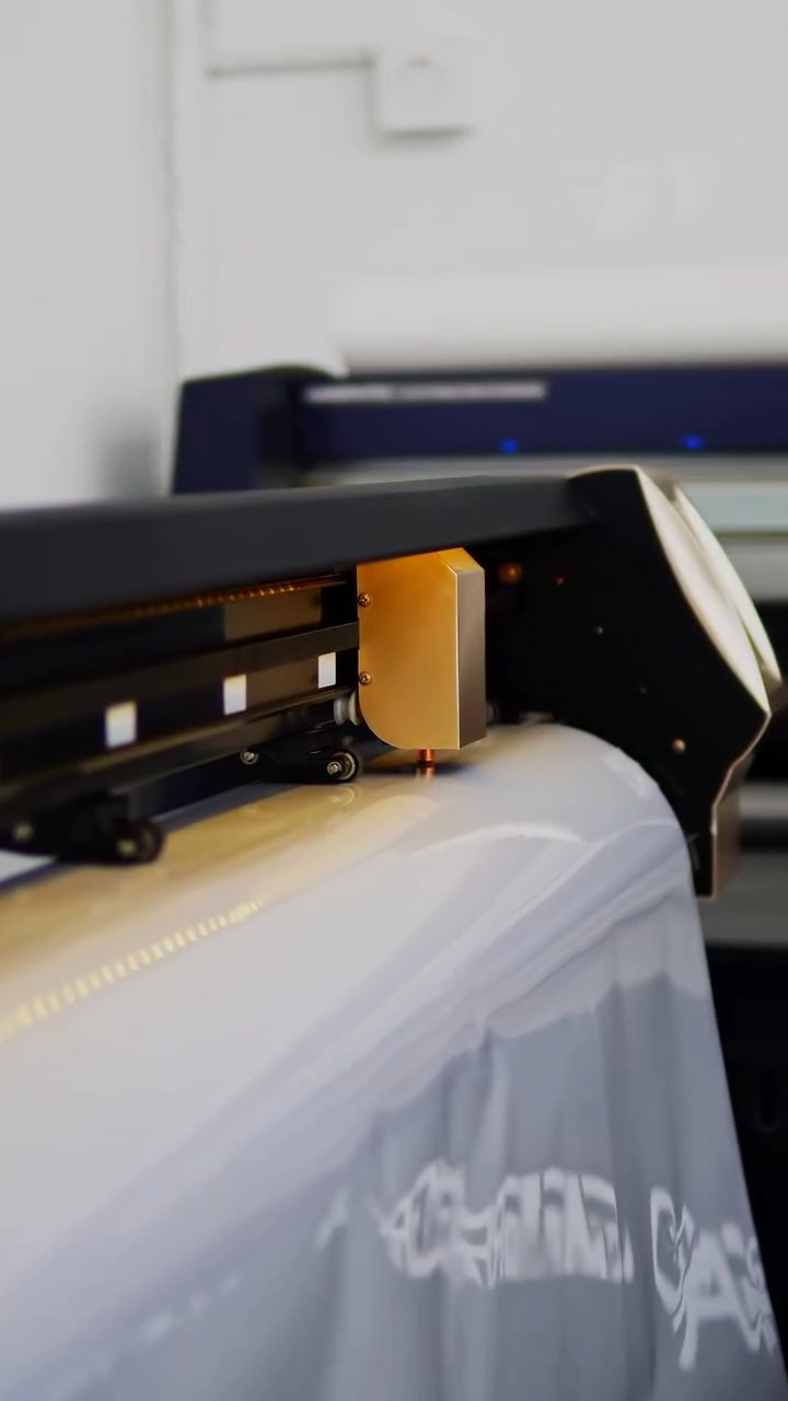 Plotter cutting PPF patterns for the Porsche 911 Carrera at Apex Detail Studio Dubai