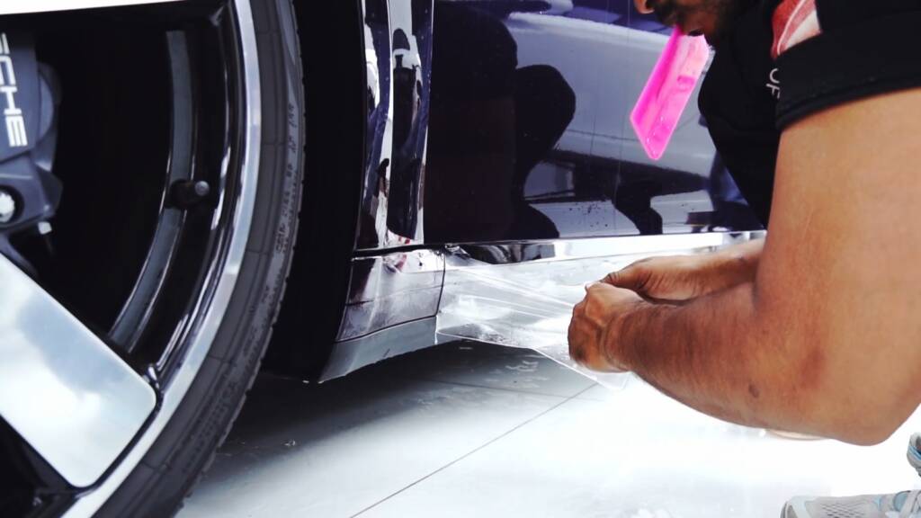 PPF wrapped around the door edge of a Viola Metallic Porsche 911 Carrera in Dubai