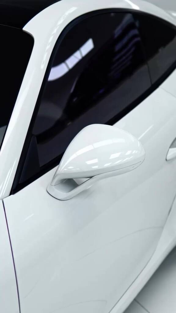 Porsche 911 Carrera door mirror in original white before colour PPF