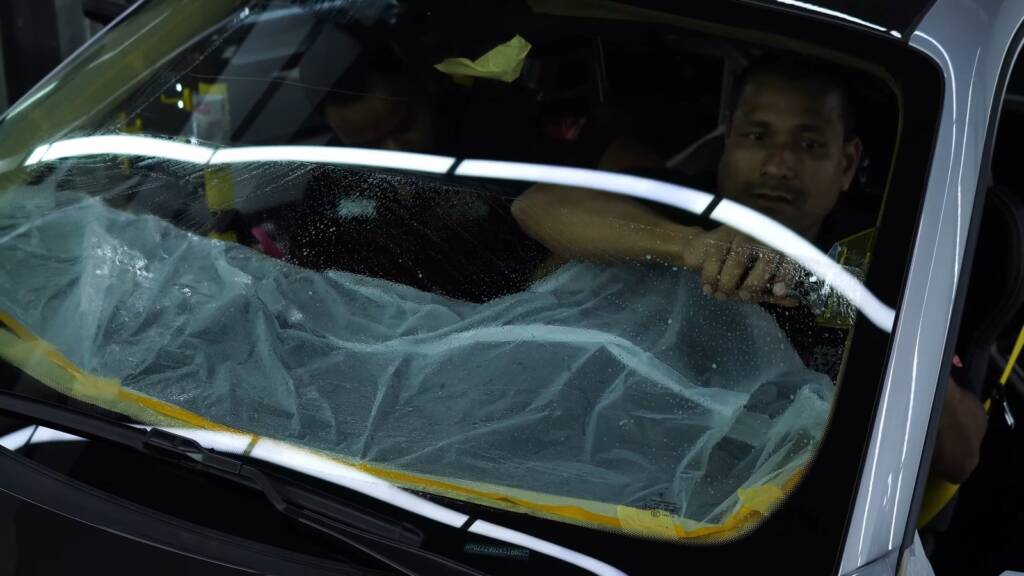 Windshield protection film being fitted to a Porsche 911 GT3 RS Weissach in Dubai