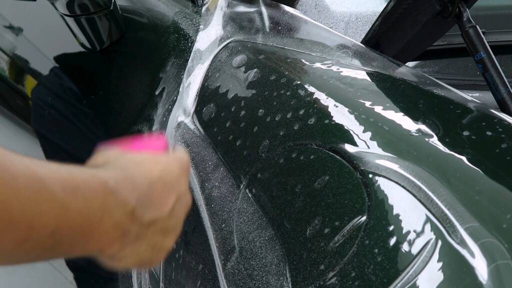 Paint protection film going onto the front wing of a new Porsche 992.2 GT3 in Dubai