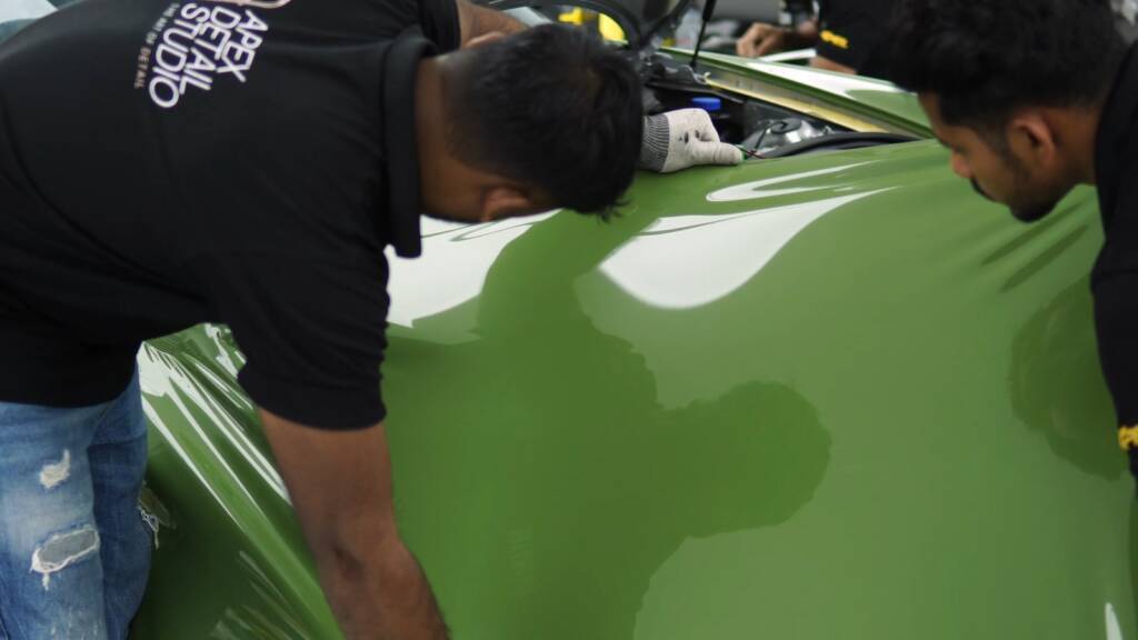 Green colour PPF stretched over the rear quarter of a Porsche 911 997 at Apex Dubai