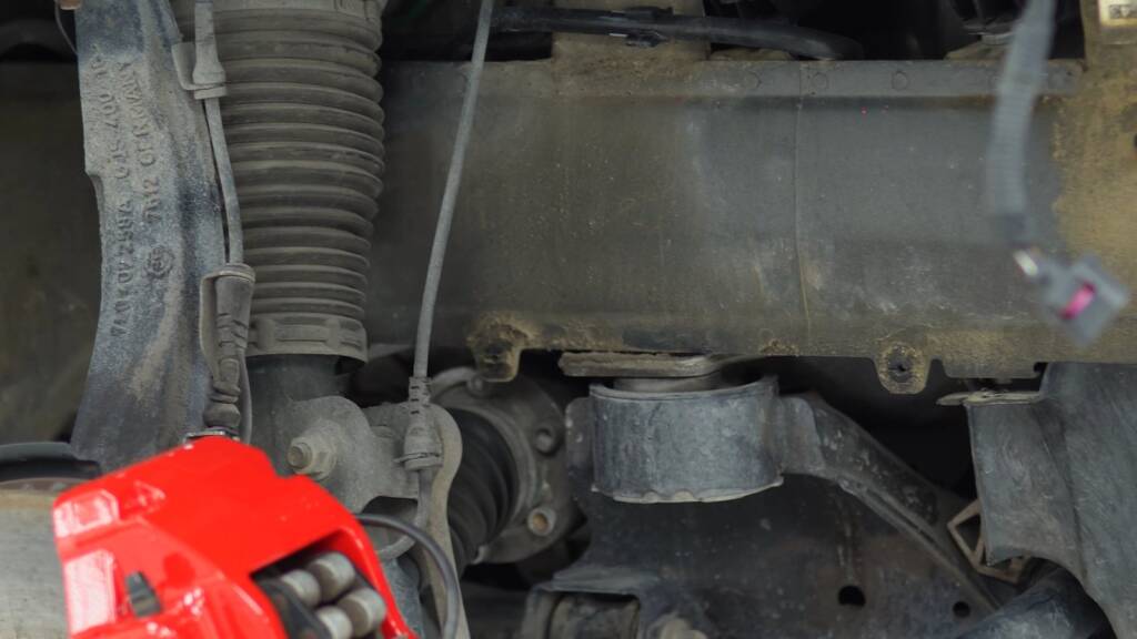 Engine bay of a black Porsche Cayenne being deep cleaned at Apex Detail Studio Dubai