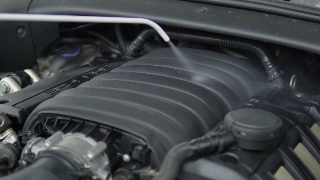 Porsche Cayenne engine cover being cleaned at Apex