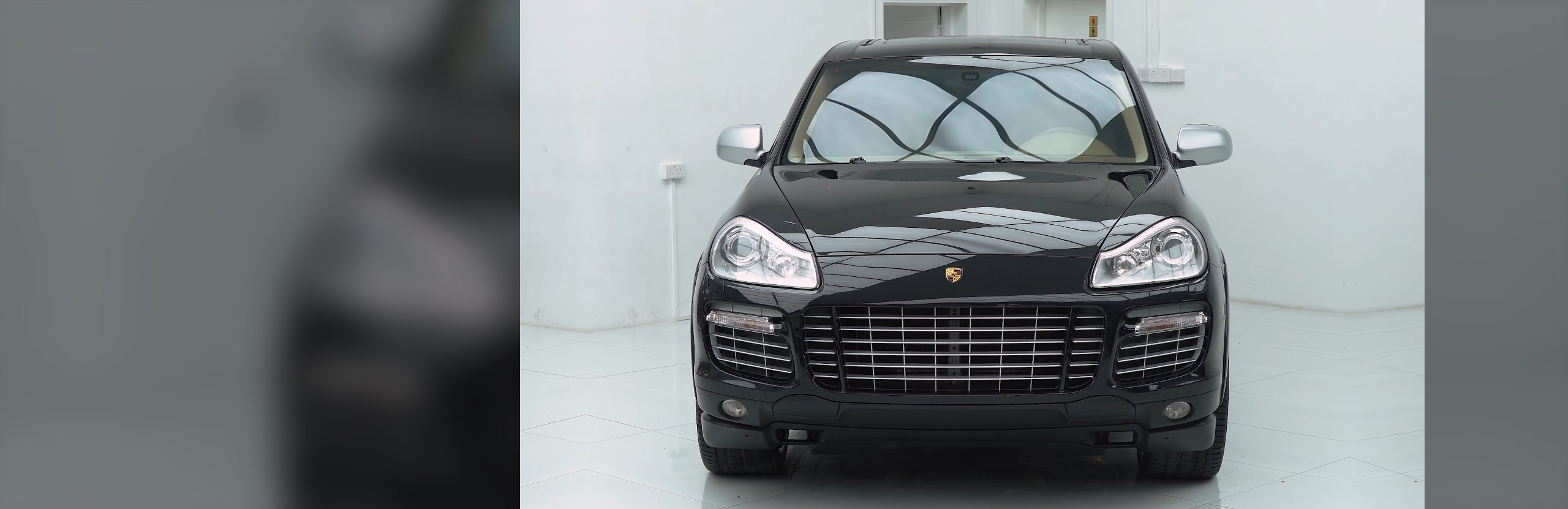 Porsche Cayenne Paint Restoration and Trim Repaint in Dubai: Black Trim to Silver
