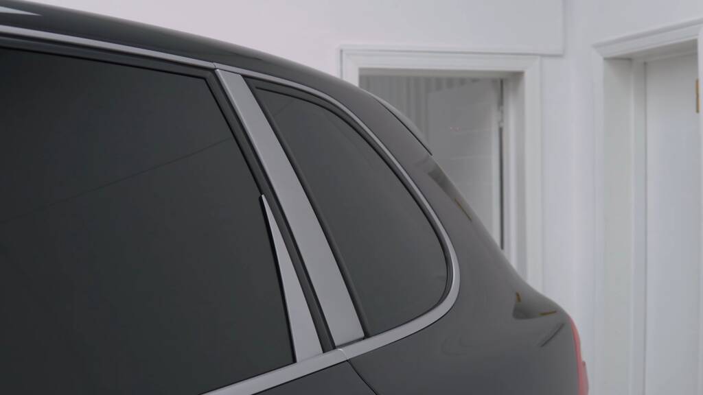 Restored gloss black paint on a Porsche Cayenne after paint correction