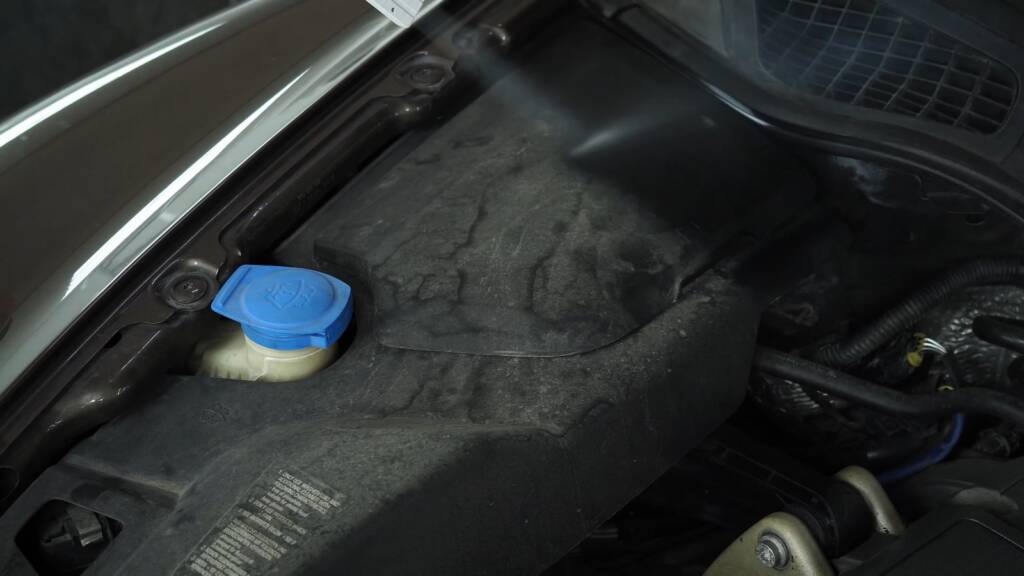 Porsche Cayenne Turbo washer reservoir area before dry ice