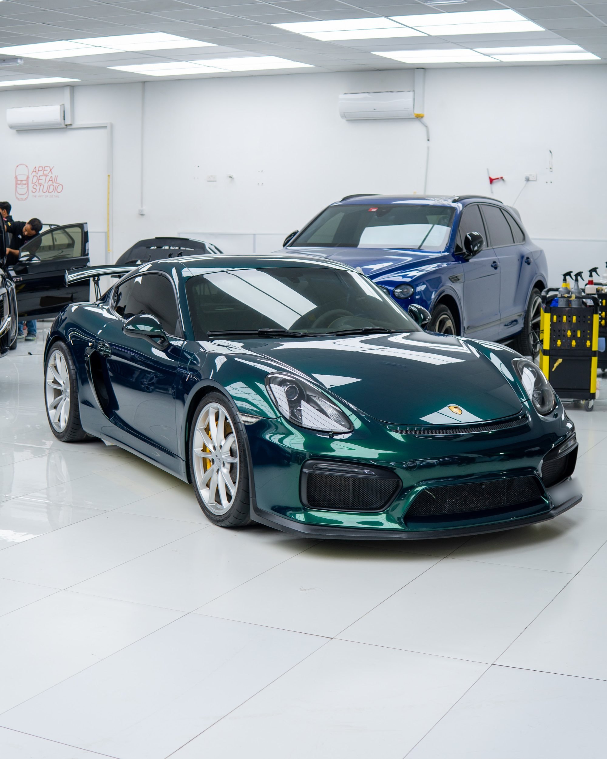 Porsche Cayman GT4 after a full colour change to deep metallic green colour PPF at Apex Detail Studio, Dubai