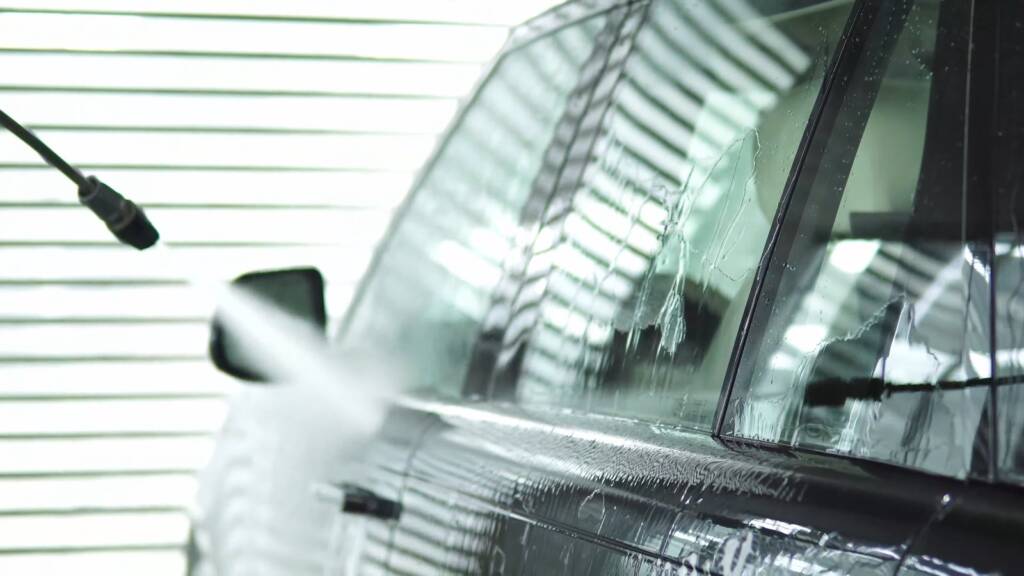 Rinsing a dark grey Range Rover Autobiography before PPF