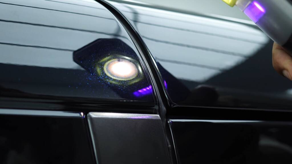 Torch inspection of PPF cut marks on a Range Rover