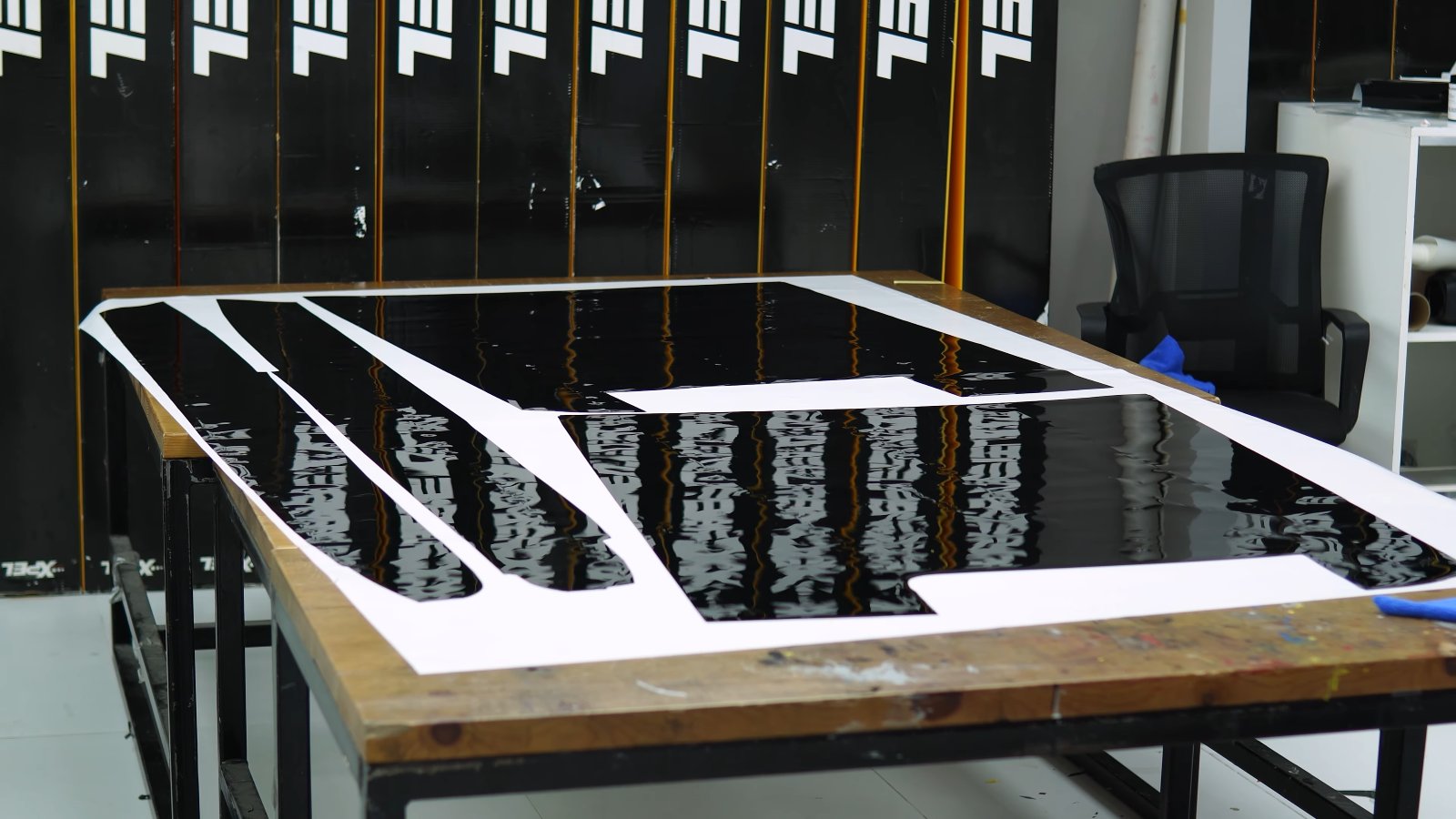Gloss black colour PPF on the cutting table for a Range Rover at Apex Detail Studio
