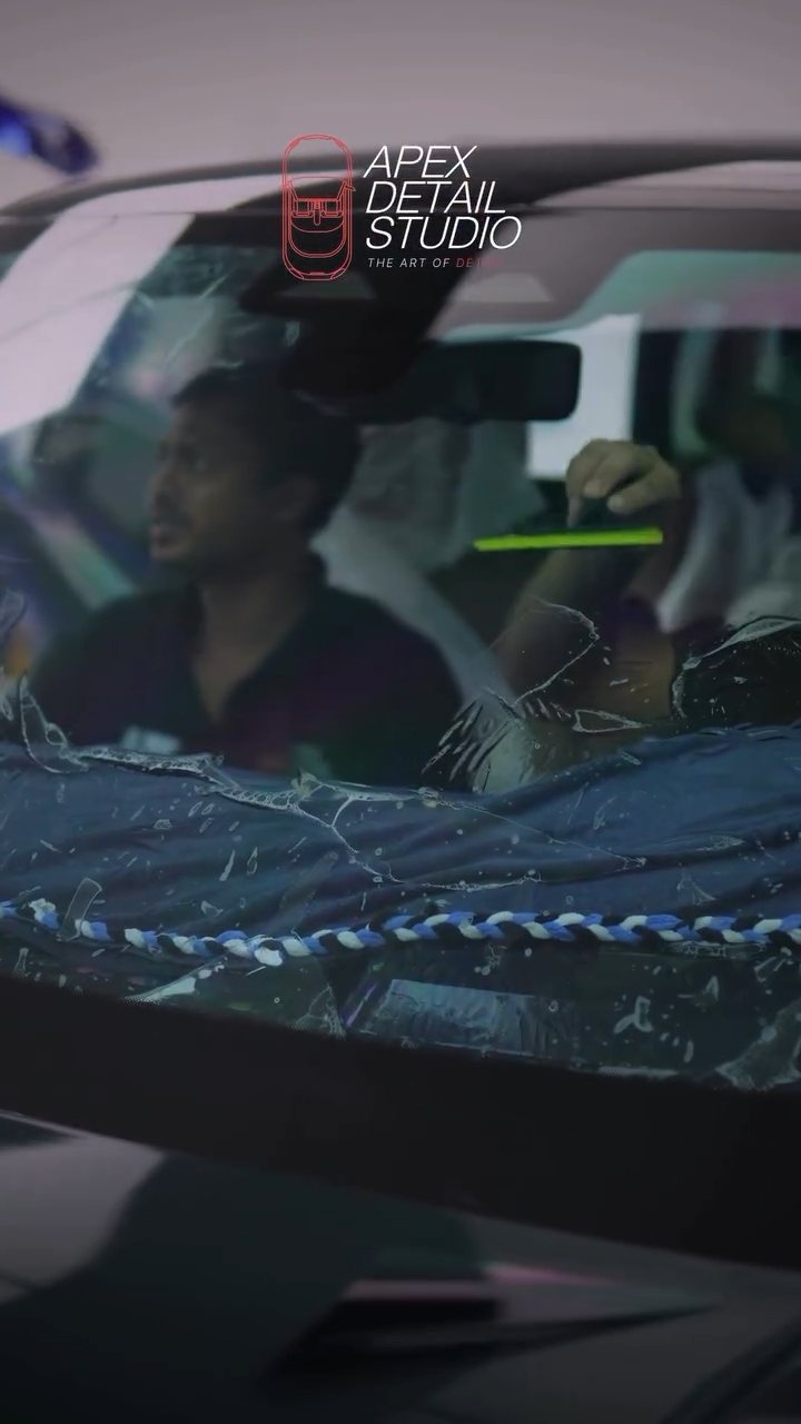 Installer inside the Range Rover cabin during window tint in Dubai
