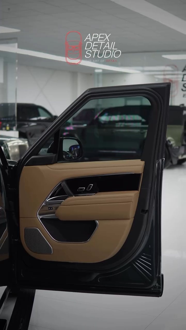 Range Rover door open showing the tan interior after window tint at Apex Detail Studio