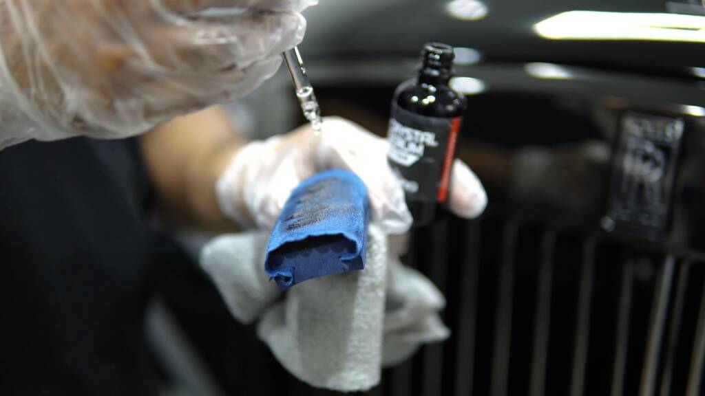 Preparing ceramic coating for a Rolls-Royce Cullinan in Dubai