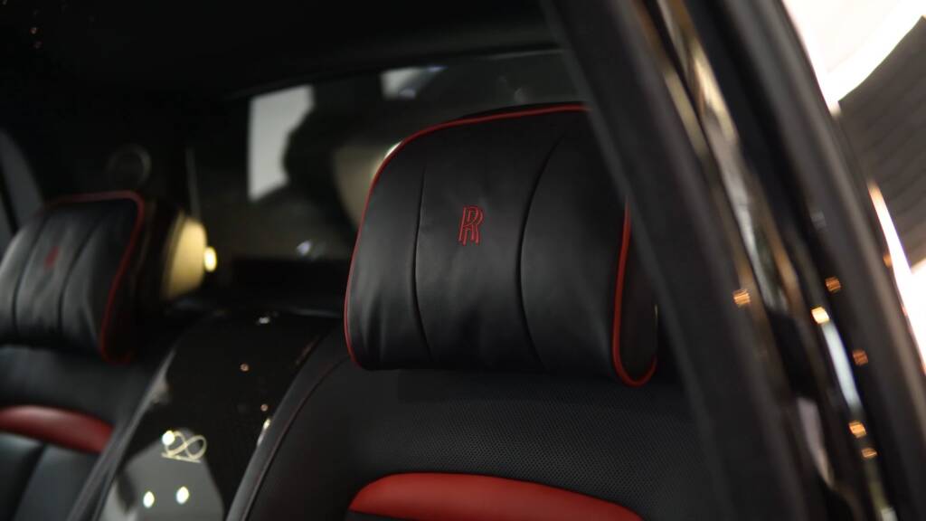 Rolls-Royce Cullinan black and red seat after detailing