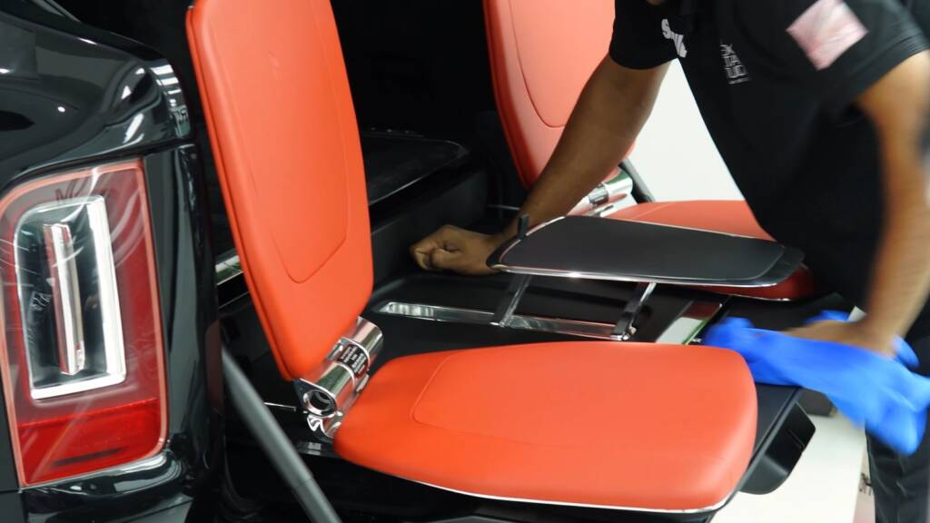 Rolls-Royce Cullinan red tailgate seats during interior detailing