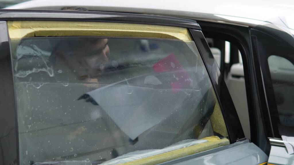 Window film being fitted to the glass of a Rolls-Royce Ghost at Apex Dubai