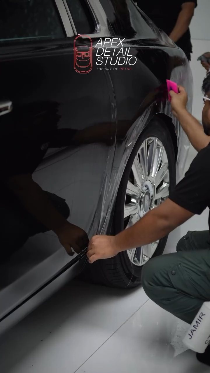 Installer fitting PPF to the Rolls-Royce Phantom lower door and sill in Dubai