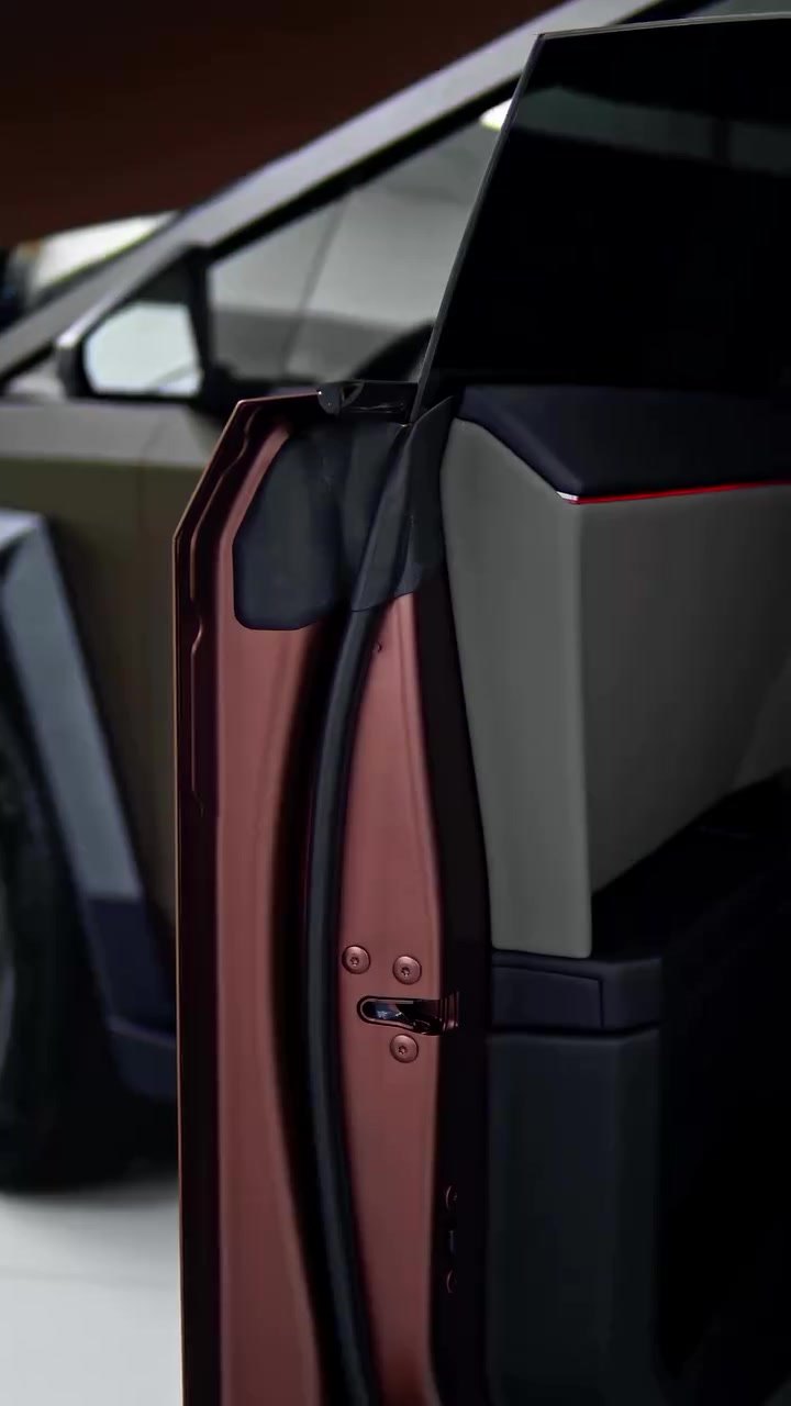 Open door of the brown PPF Tesla Cybertruck showing the wrapped door edge