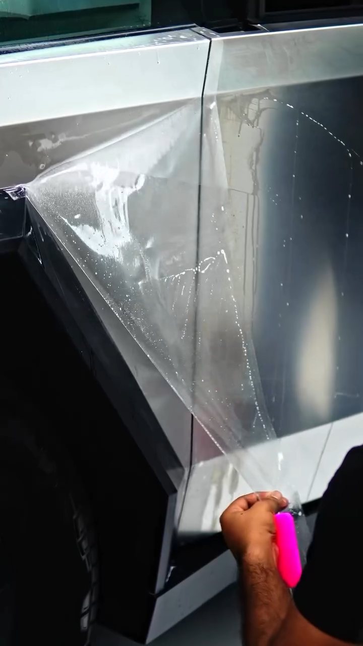 Squeegee on the Tesla Cybertruck door PPF at Apex Detail Studio Dubai