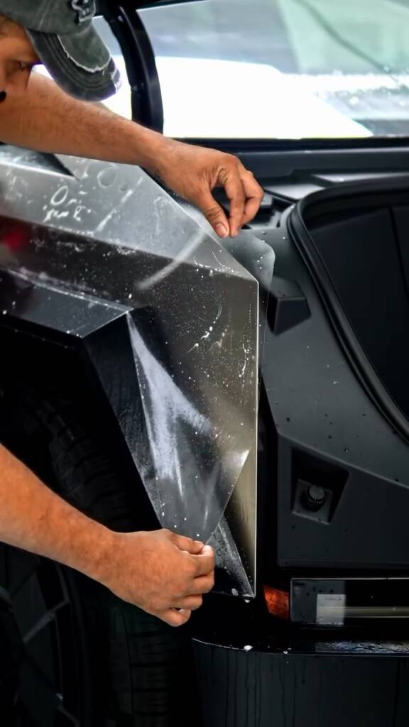 Fitting PPF on the front corner of a new Tesla Cybertruck at Apex Detail Studio Dubai