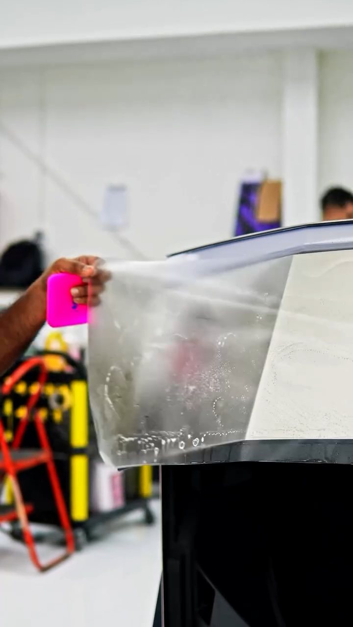 PPF sheet being positioned on the Tesla Cybertruck at Apex Detail Studio