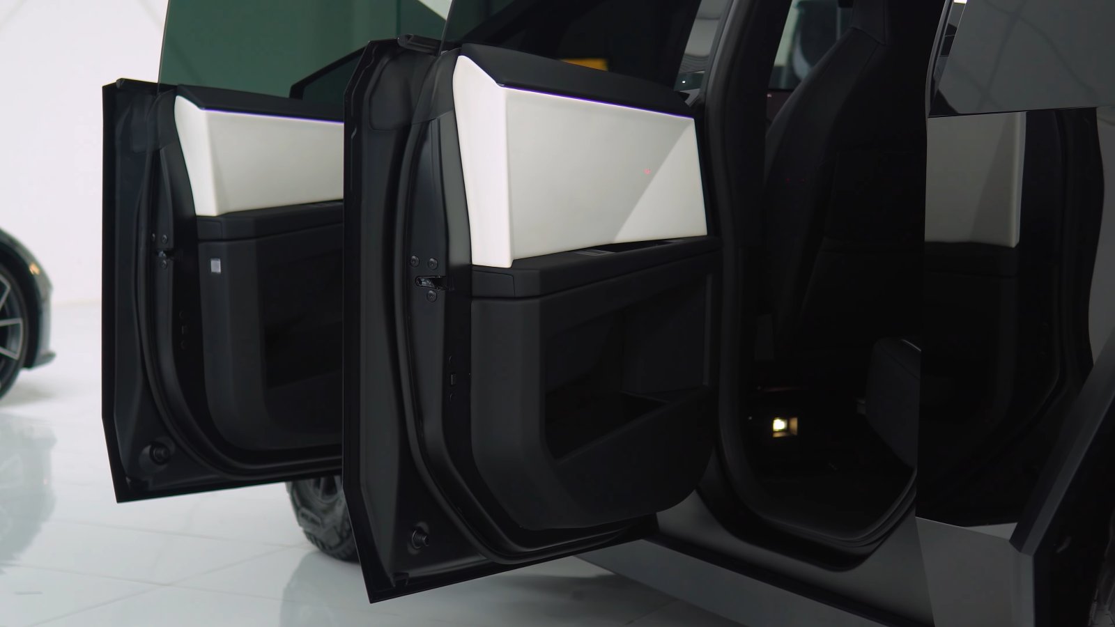 Tesla Cybertruck door shuts finished in gloss black so no stainless shows