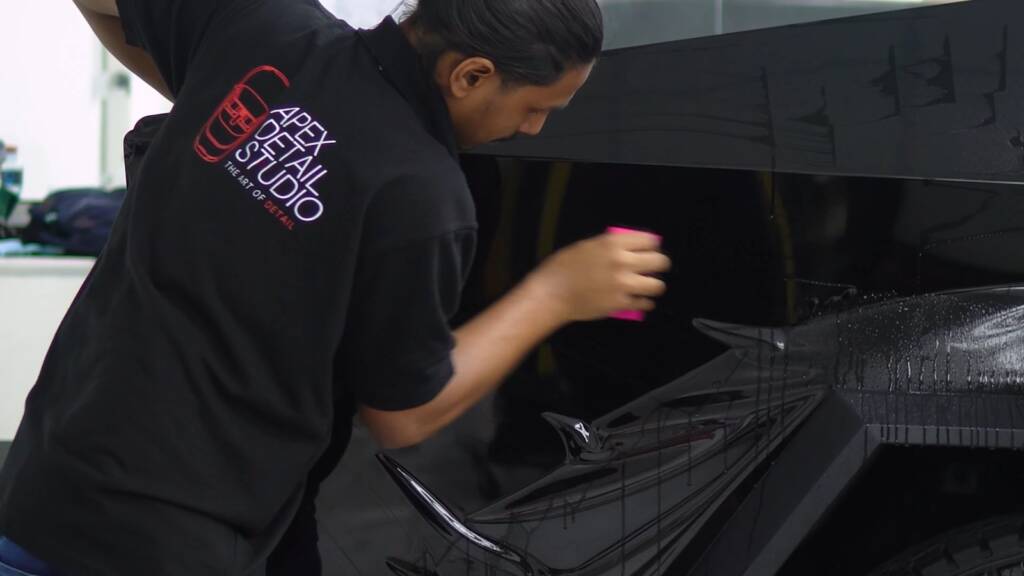 Gloss black colour PPF squeegeed flat on a Tesla Cybertruck side panel at Apex Detail Studio Dubai